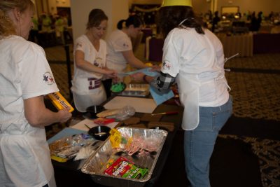 Competitors working at their table